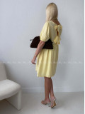 Mušelínové šaty s mašlemi na zádech žluté AB 174