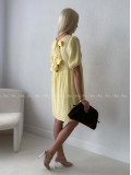 Mušelínové šaty s mašlemi na zádech žluté AB 174