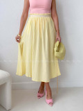 Midi mušelínová sukňa s rázporkom žltá AB 176